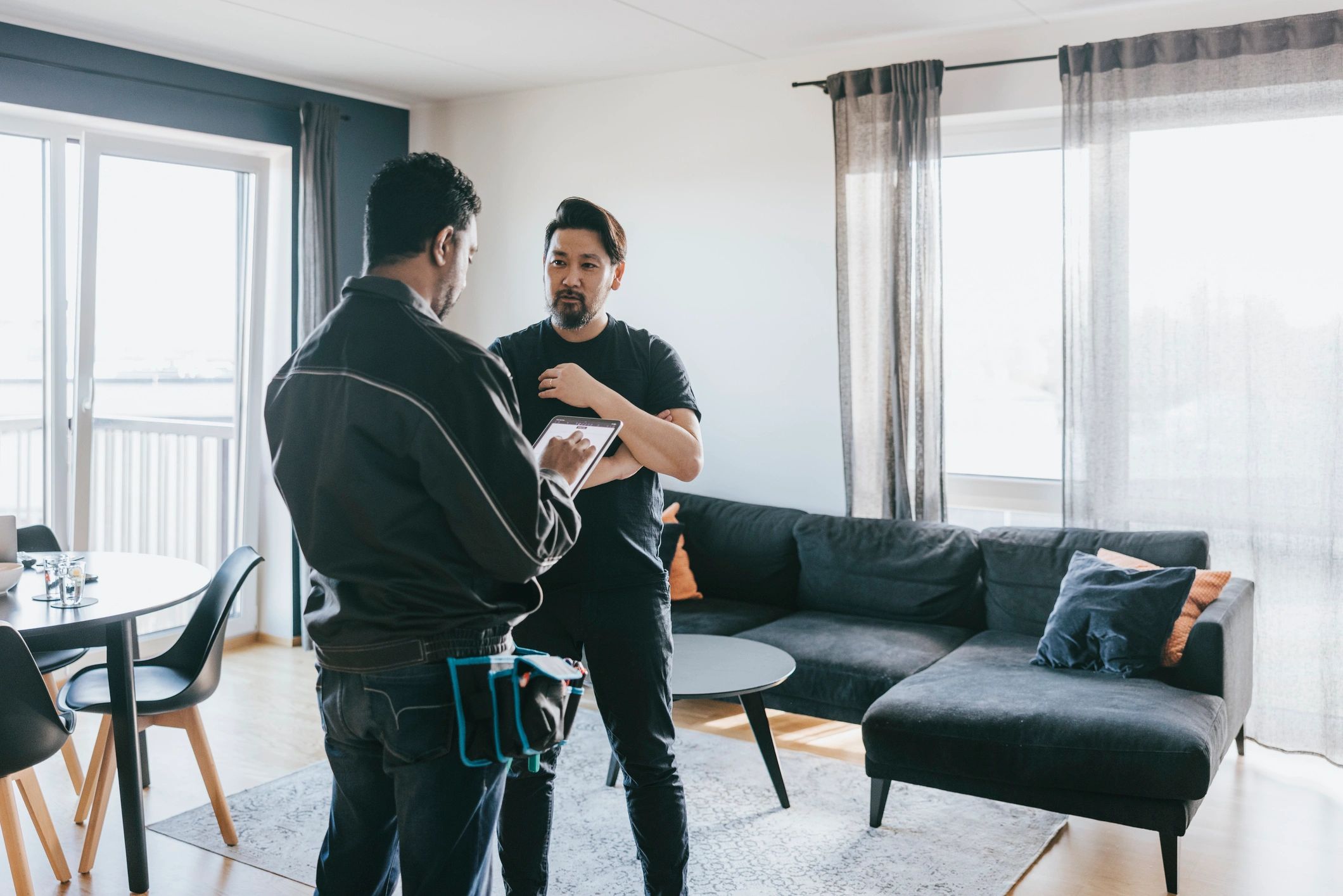 Real estate professional consulting with a client at home